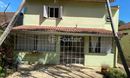 Casa com 3 quartos à venda na Rua Ibirubá, 94, Cavalhada, Porto Alegre, 277 m2 por R$ 799.999
