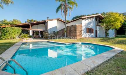 Casa em condomínio fechado com 3 quartos à venda na Avenida da Cavalhada, 5205, Cavalhada, Porto Alegre, 388 m2 por R$ 4.900.000