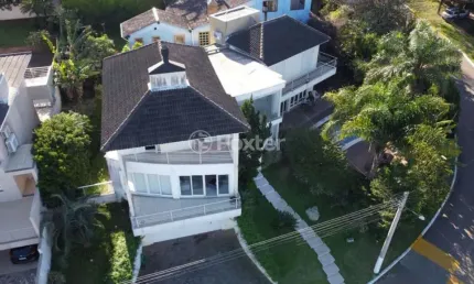 Casa em condomínio fechado com 3 quartos à venda na Avenida Senador Salgado Filho, 1068, Cecília, Viamão, 305 m2 por R$ 1.260.000