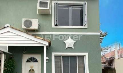 Casa em condomínio fechado com 3 quartos à venda na Avenida Santos Ferreira, 1180, Marechal Rondon, Canoas, 78 m2 por R$ 480.000