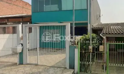Casa com 3 quartos à venda na Rua Maria Terezinha Neto Farias, 155, Jardim Algarve, Alvorada, 196 m2 por R$ 445.000