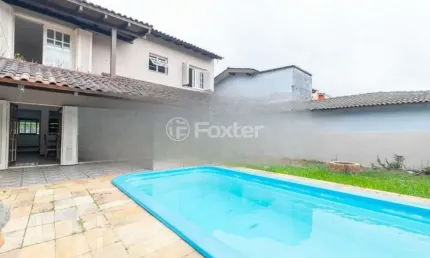 Casa com 4 quartos à venda na avenida guaíba, 13166, guarujá, porto alegre, 334 m2 por r$ 900.000