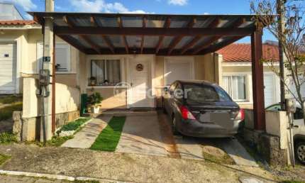 Casa em condomínio fechado com 2 quartos à venda na Rua Oscar Schick, 1911, Formoza, Alvorada, 67 m2 por R$ 255.000