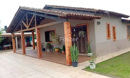 Casa em condomínio fechado com 3 quartos à venda na Rua Valença, 45, Planalto, Viamão, 48044 m2 por R$ 390.000
