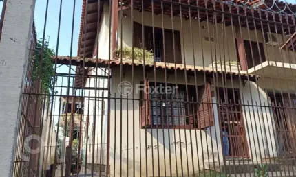 Casa com 3 quartos à venda na avenida doutor petrônio portella, 1415, parque santa fé, porto alegre, 267 m2 por r$ 850.000