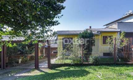 Casa com 3 quartos à venda na Avenida Outeiro, 368, Coronel Aparício Borges, Porto Alegre, 98 m2 por R$ 313.000