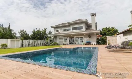Casa em condomínio fechado com 5 quartos à venda na avenida juca batista, 8000, belém novo, porto alegre, 413 m2 por r$ 3.600.000