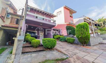 Casa em condomínio fechado com 3 quartos à venda na Rua Erechim, 100, Nonoai, Porto Alegre, 190 m2 por R$ 730.000