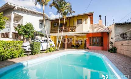 Casa com 4 quartos à venda na Rua Cacilda Yaconis Becker, 223, Rubem Berta, Porto Alegre, 300 m2 por R$ 693.500