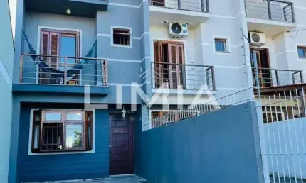 Casa com 3 quartos à venda na Rua Hugo Nelson Magalhães, 141, Parque Santa Fé, Porto Alegre, 170 m2 por R$ 425.000