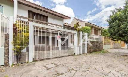 Casa com 4 quartos à venda na Rua Maestro Salvador Campanella, 58, Jardim Itu Sabará, Porto Alegre, 240 m2 por R$ 1.025.000