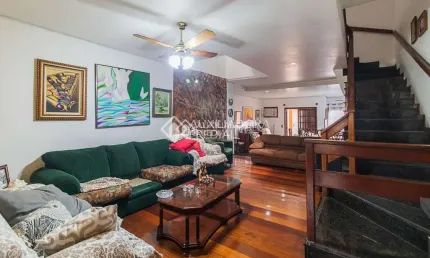 Casa em condomínio fechado com 3 quartos à venda na Rua Santa Maria, 186, São José, Porto Alegre, 279 m2 por R$ 799.000