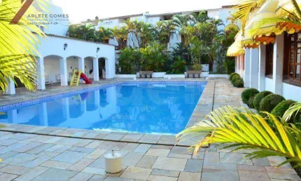 Sobrado com 3 dormitórios à venda, 210 m² por R$ 1.300.000,00 - Loteamento João Batista Julião - Guarujá/SP
