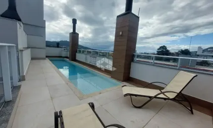 APARTAMENTO SEMIMOBILIADO NO CORREGO GRANDE 1 QUARTO 2 VAGAS E SACADA COM CHURRASQUEIRA