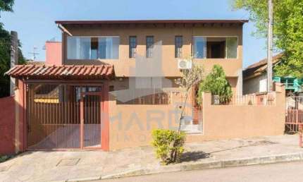 Casa com 4 quartos à venda na Rua Adroaldo Novo Correa, 126, Cavalhada, Porto Alegre por R$ 650.000