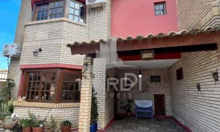 Casa com 3 quartos à venda na Rua Jacundá, 641, Guarujá, Porto Alegre por R$ 585.000