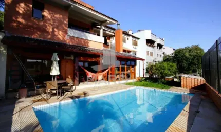 Casa com 4 quartos à venda na Rua Alcebíades Antônio dos Santos, 157, Nonoai, Porto Alegre por R$ 1.650.000