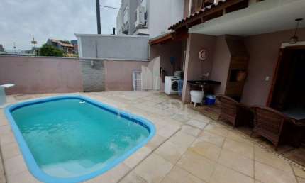 Casa em condomínio fechado com 3 quartos à venda na Rua Carlos Maximiliano Fayet, 215, Hípica, Porto Alegre por R$ 600.000