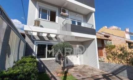 Casa em condomínio fechado com 3 quartos à venda na Rua Felipe Arísio, 121, Hípica, Porto Alegre por R$ 790.000