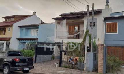 Casa com 3 quartos à venda na Rua Attilio Bettio, 92, Aberta dos Morros, Porto Alegre por R$ 580.000