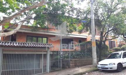Casa com 4 quartos à venda na Rua Fonseca Guimarães, 34, Medianeira, Porto Alegre por R$ 1.600.000