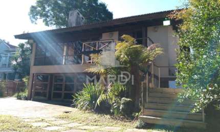 Casa em condomínio fechado com 3 quartos para alugar na Avenida da Cavalhada, 5205, Cavalhada, Porto Alegre por R$ 6.000
