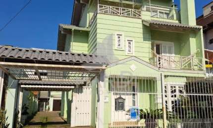 Casa com 4 quartos à venda na Rua Folha da Tarde, 49, Cristal, Porto Alegre por R$ 1.635.000