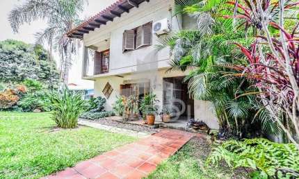 Casa em condomínio fechado com 4 quartos à venda na Acesso das Orquídeas, 93, Santa Tereza, Porto Alegre por R$ 520.000
