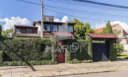 Casa com 3 quartos à venda na Avenida Guarujá, 140, Guarujá, Porto Alegre por R$ 749.000