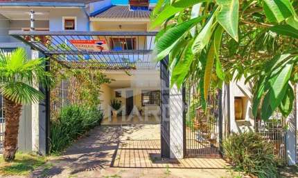 Casa com 4 quartos à venda na Rua Claudio da Silva Pinto, 287, Espírito Santo, Porto Alegre por R$ 599.000