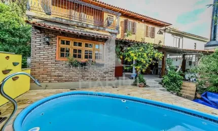 Casa em condomínio fechado com 4 quartos à venda na das Figueiras, 108, Santa Tereza, Porto Alegre por R$ 650.000