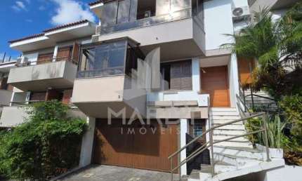 Casa em condomínio fechado com 3 quartos à venda na Avenida Jacuí, 740, Cristal, Porto Alegre por R$ 1.080.000