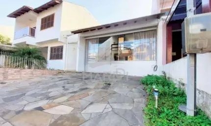 Casa em condomínio fechado com 3 quartos à venda na Rua Guatambu, 109, Hípica, Porto Alegre por R$ 535.000