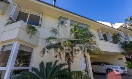 Casa em condomínio fechado com 3 quartos à venda na Rua Doutor Arnaldo da Silva Ferreira, 465, Jardim Isabel, Porto Alegre por R$ 1.150.000