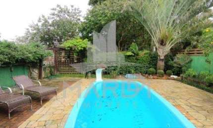 Casa em condomínio fechado com 3 quartos à venda na Avenida Edgar Pires de Castro, 540, Hípica, Porto Alegre por R$ 999.990