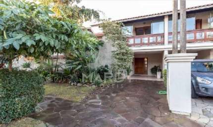 Casa em condomínio fechado com 3 quartos à venda na Avenida Eduardo Prado, 2050, Cavalhada, Porto Alegre por R$ 960.000
