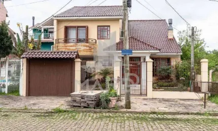 Casa com 3 quartos à venda na Avenida Guaíba, 13914, Ipanema, Porto Alegre por R$ 990.000