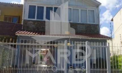 Casa com 3 quartos à venda na Rua Carlos Scliar, 99, Hípica, Porto Alegre por R$ 750.000