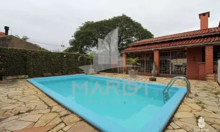 Casa com 3 quartos à venda na Avenida Guarujá, 70, Guarujá, Porto Alegre por R$ 599.000