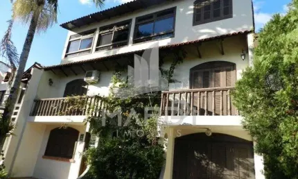 Casa em condomínio fechado com 5 quartos à venda na Avenida Otto Niemeyer, 1199, Tristeza, Porto Alegre por R$ 595.000