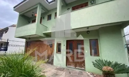 Casa em condomínio fechado com 3 quartos à venda na Rua Louro, 34, Hípica, Porto Alegre por R$ 680.000