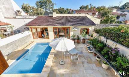 Casa em condomínio fechado com 5 quartos à venda na Avenida Pereira Passos, 239, Vila Assunção, Porto Alegre por R$ 2.450.000