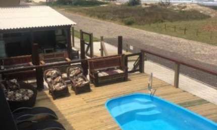 POUSADA COM 14 APARTAMENTOS MOBILIADOS NA AV BEIRA MAREM TRAMANDAÍ