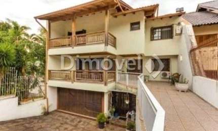Casa com 4 quartos à venda na Rua Caeté, 600, Vila Assunção, Porto Alegre por R$ 1.590.000