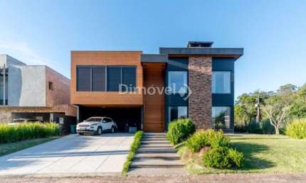 Casa em condomínio fechado com 5 quartos à venda na Avenida Juca Batista, 8000, Belém Novo, Porto Alegre por R$ 3.800.000