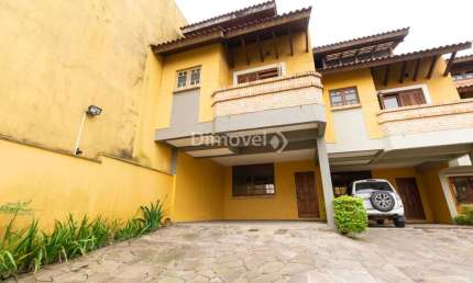 Casa em condomínio fechado com 3 quartos à venda na Rua Edgar Luiz Schneider, 54, Jardim Isabel, Porto Alegre por R$ 775.000