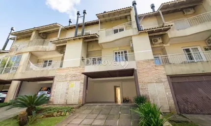 Casa em condomínio fechado com 3 quartos à venda na Avenida Coronel Marcos, 39, Pedra Redonda, Porto Alegre por R$ 980.000