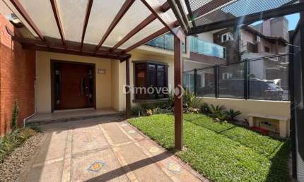 Casa em condomínio fechado com 3 quartos à venda na Rua Roberto Santini, 194, Hípica, Porto Alegre por R$ 650.000