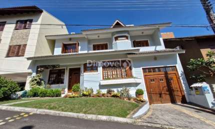 Casa em condomínio fechado com 4 quartos à venda na Avenida Vicente Monteggia, 2000, Cavalhada, Porto Alegre por R$ 1.487.000
