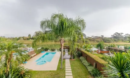 Casa em condomínio fechado com 4 quartos à venda na Avenida Juca Batista, 8000, Belém Novo, Porto Alegre por R$ 2.400.000